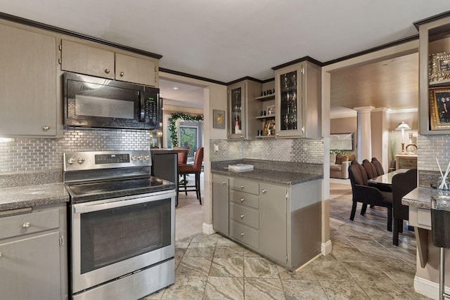 kitchen featuring black microwave, stainless steel range with electric stovetop, crown molding, ornate columns, and backsplash
