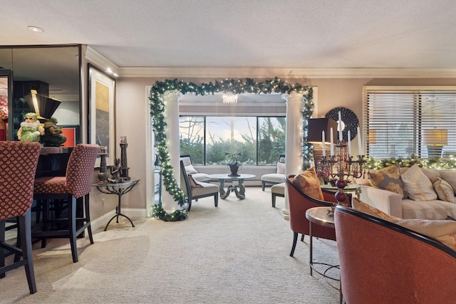 carpeted living room featuring ornamental molding, baseboards, and a textured ceiling