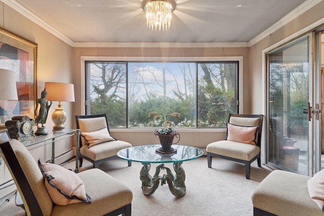 living area featuring a chandelier, carpet floors, ornamental molding, and baseboard heating