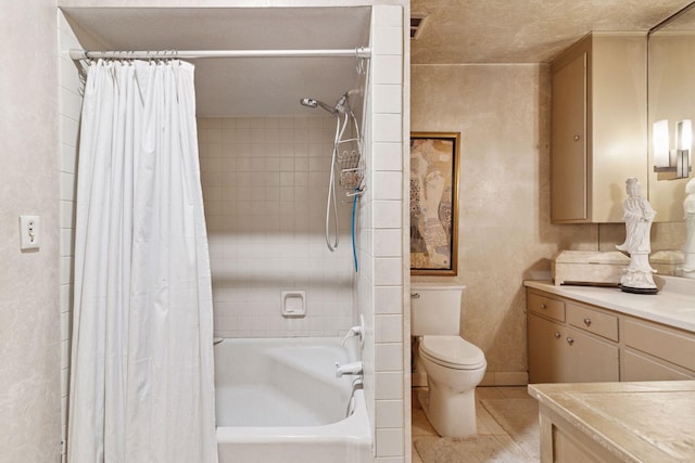full bath with toilet, vanity, shower / bath combo with shower curtain, and tile patterned flooring