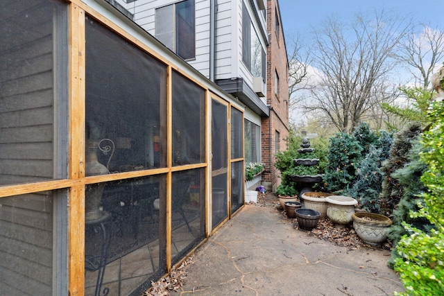 view of side of property with a sunroom