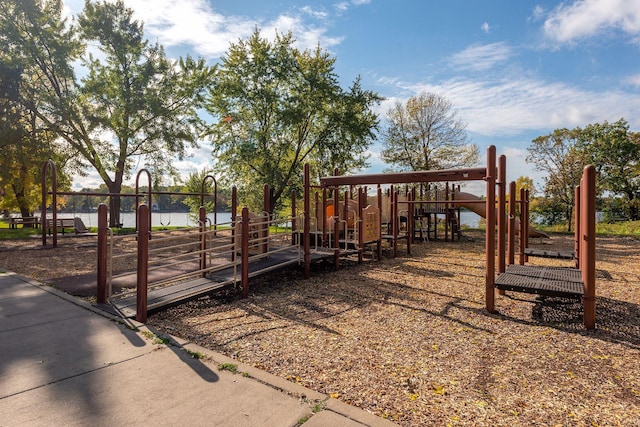 view of community with fence and a water view