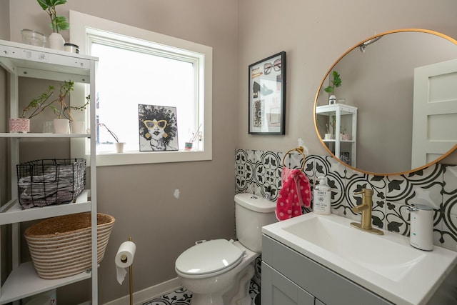 6724 Clarkia Dr NW, Rochester, MN 55901 - half bathroom featuring vanity, toilet, and baseboards