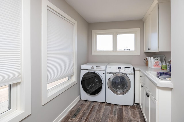 6724 Clarkia Dr NW, Rochester, MN 55901 - laundry area with dark wood finished floors, washing machine and clothes dryer, cabinet space, and baseboards