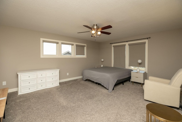 6724 Clarkia Dr NW, Rochester, MN 55901 - bedroom featuring light carpet, a ceiling fan, baseboards, and a textured ceiling