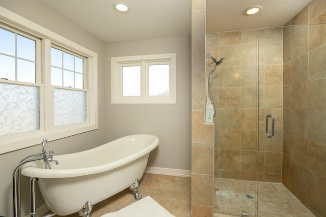 6724 Clarkia Dr NW, Rochester, MN 55901 - bathroom with a shower stall, a soaking tub, recessed lighting, and baseboards