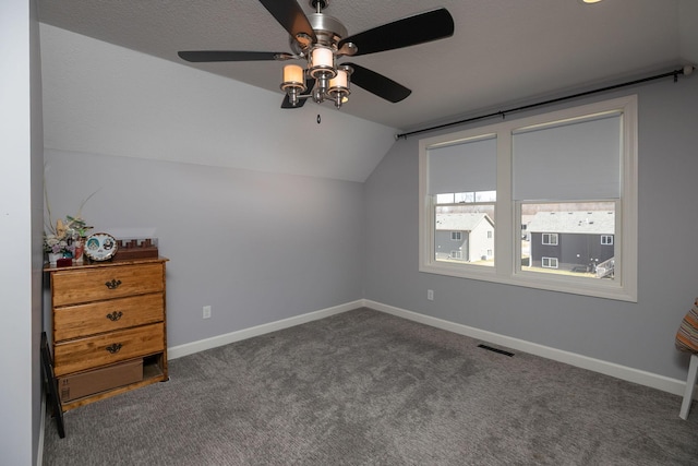 6724 Clarkia Dr NW, Rochester, MN 55901 - additional living space featuring ceiling fan, vaulted ceiling, carpet flooring, and baseboards