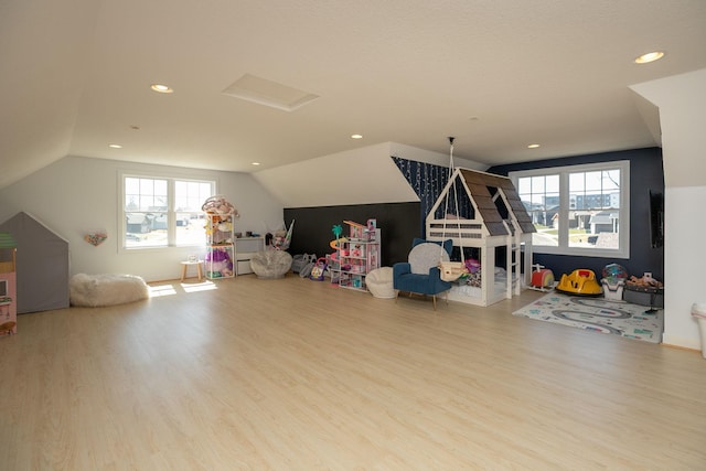 6724 Clarkia Dr NW, Rochester, MN 55901 - recreation room featuring wood finished floors, vaulted ceiling, and recessed lighting