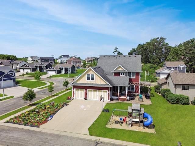 6724 Clarkia Dr NW, Rochester, MN 55901 - view of front facade with a playground, a residential view, concrete driveway, a front lawn, and board and batten siding