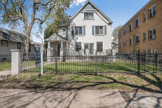 victorian-style house featuring a fenced front yard and a front yard