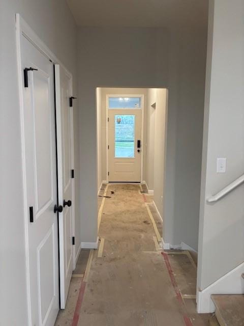 corridor featuring baseboards
