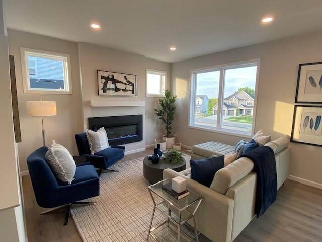 14570 Kingsview Ln N, Dayton, MN 55327 - living area featuring recessed lighting, wood finished floors, and a glass covered fireplace