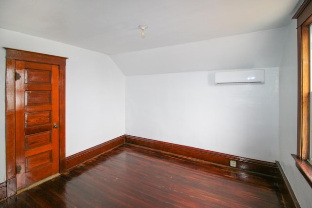18848 223rd St, Richmond, MN 56368 - bonus room featuring a wall mounted AC, wood finished floors, baseboards, and vaulted ceiling