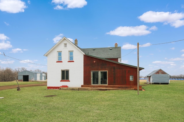 18848 223rd St, Richmond, MN 56368 - back of house with a chimney and a lawn