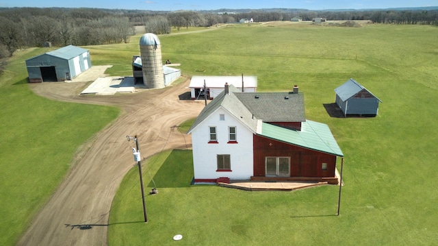 18848 223rd St, Richmond, MN 56368 - rear view of house with a rural view, a detached garage, and an outdoor structure