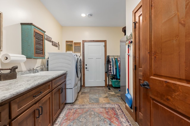 16605 Piper Ln, Brainerd, MN 56401 - laundry room featuring cabinet space, light stone finish flooring, and separate washer and dryer
