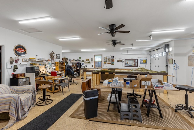 16605 Piper Ln, Brainerd, MN 56401 - miscellaneous room with speckle patterned floor, a workshop area, and a ceiling fan