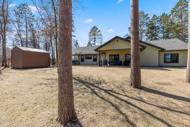 16605 Piper Ln, Brainerd, MN 56401 - back of house with an outbuilding and fence