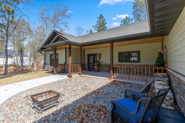 16605 Piper Ln, Brainerd, MN 56401 - view of front of home with a porch, stone siding, and roof with shingles