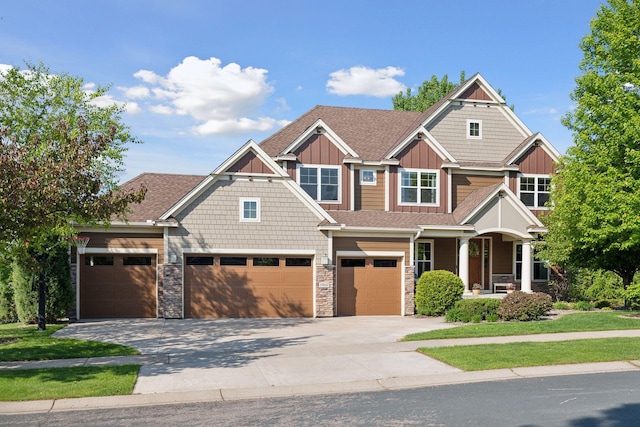 17607 64th Pl N, Maple Grove, MN 55311 - craftsman-style home with concrete driveway, board and batten siding, an attached garage, a porch, and stone siding