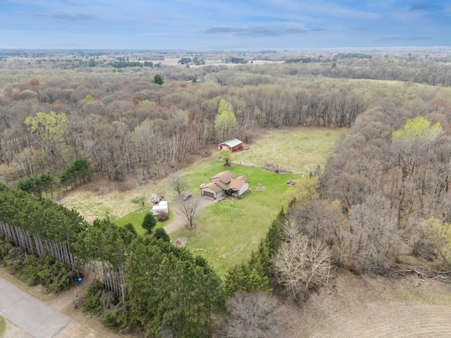 aerial view with a rural view and a wooded view