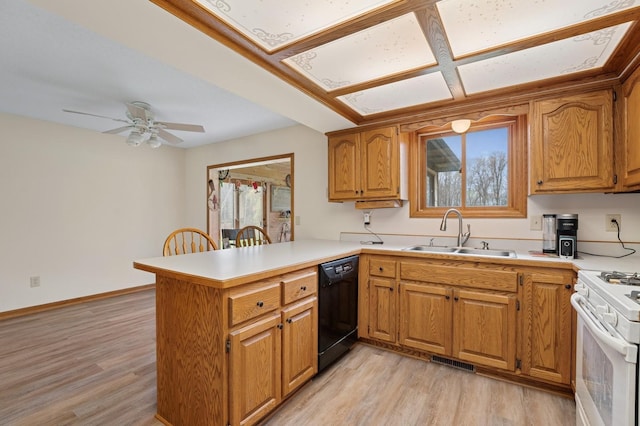 kitchen with a sink, black dishwasher, a peninsula, white gas stove, and visible vents