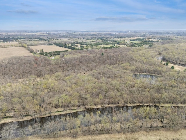 drone / aerial view with a water view and a wooded view