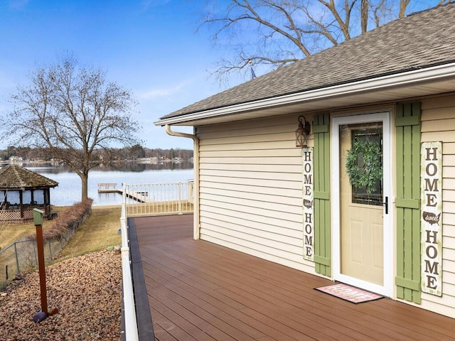 deck with a water view and a gazebo