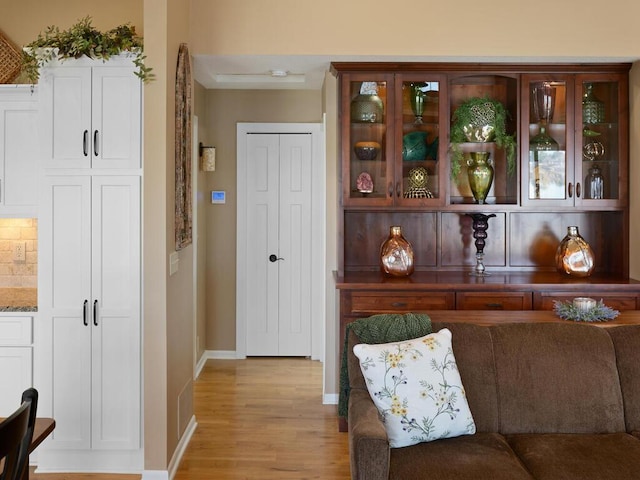 interior space with light wood-style flooring and baseboards