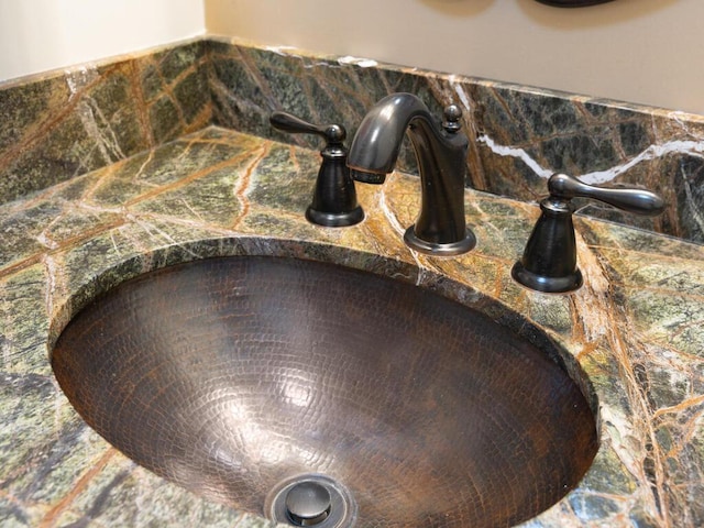 bathroom view of a sink and backsplash
