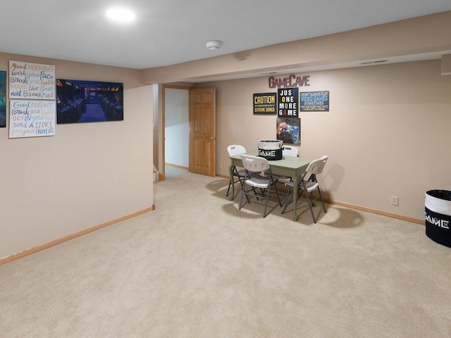 dining space featuring carpet and baseboards