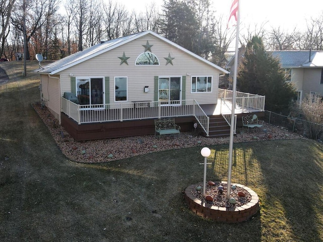back of house featuring a wooden deck