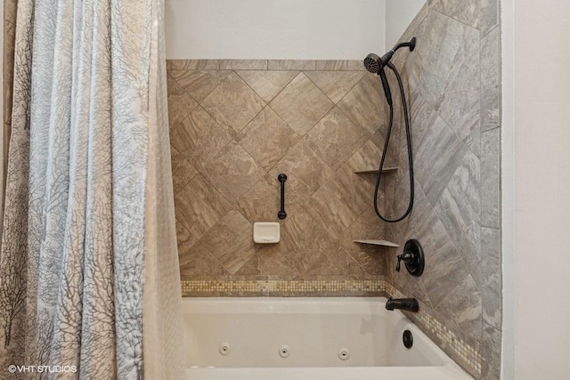bathroom with a combined bath / shower with jetted tub