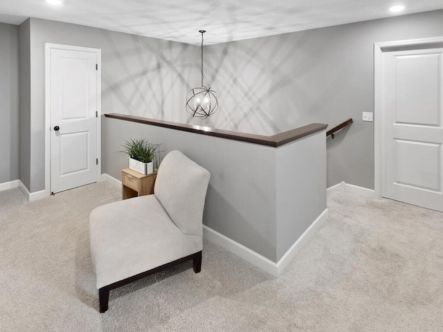 living area featuring an inviting chandelier, carpet, recessed lighting, an upstairs landing, and baseboards