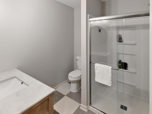 full bath with toilet, a shower stall, vanity, and baseboards