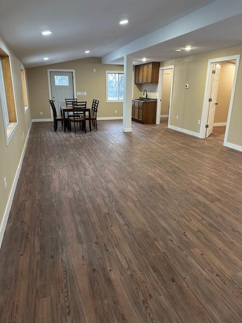 482 US Highway 12, Ortonville, MN 56278 - dining room featuring dark wood-style flooring, baseboards, recessed lighting, and lofted ceiling