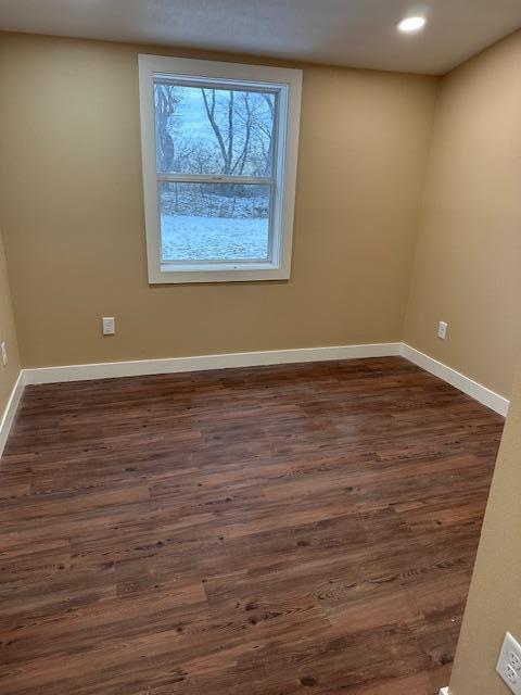 482 US Highway 12, Ortonville, MN 56278 - empty room with dark wood finished floors, baseboards, and recessed lighting