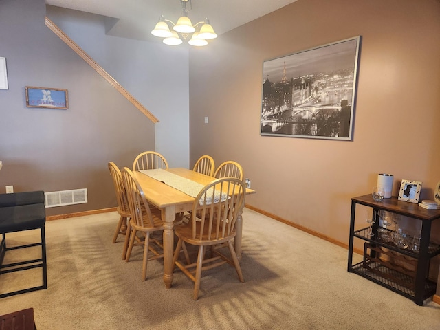 14494 Sumter Ave, Savage, MN 55378 - dining space with carpet floors, a chandelier, and baseboards