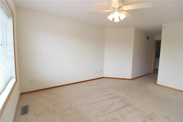 14494 Sumter Ave, Savage, MN 55378 - spare room with carpet flooring, baseboards, and a ceiling fan