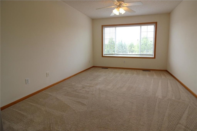 14494 Sumter Ave, Savage, MN 55378 - empty room featuring light colored carpet, a ceiling fan, and baseboards