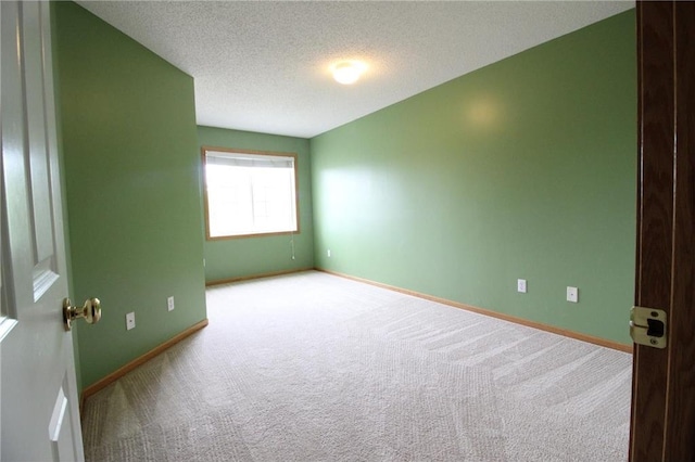 14494 Sumter Ave, Savage, MN 55378 - unfurnished room featuring carpet flooring, baseboards, and a textured ceiling
