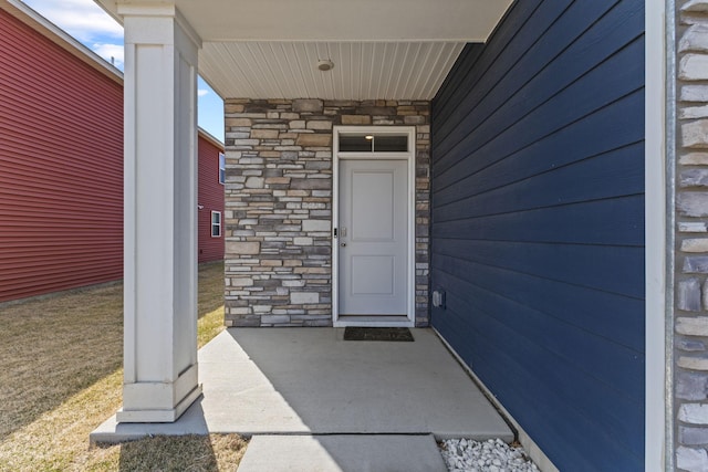 12678 Erskin St NE, Blaine, MN 55449 - entrance to property with stone siding and covered porch
