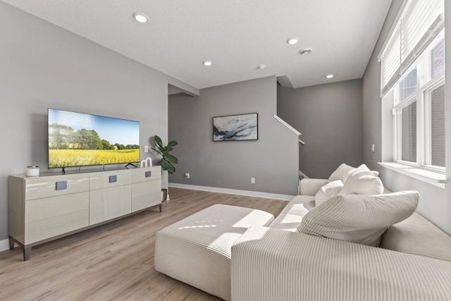 12678 Erskin St NE, Blaine, MN 55449 - living area featuring light wood finished floors, baseboards, and recessed lighting
