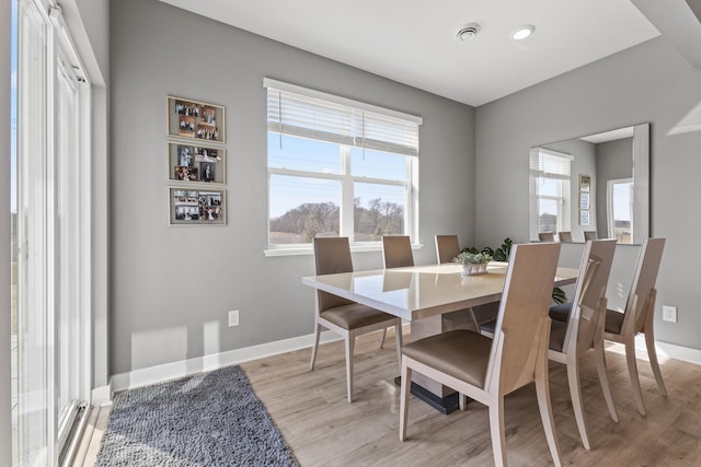 12678 Erskin St NE, Blaine, MN 55449 - dining space with light wood-style flooring, baseboards, and recessed lighting