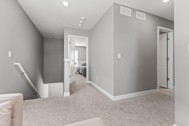 12678 Erskin St NE, Blaine, MN 55449 - hallway featuring an upstairs landing, carpet flooring, and baseboards