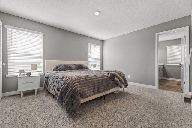 12678 Erskin St NE, Blaine, MN 55449 - bedroom featuring light colored carpet and baseboards