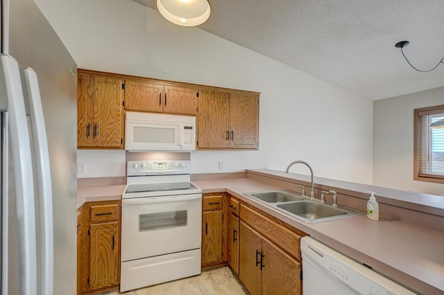 14831 Endicott Way Unit 315, Apple Valley, MN 55124 - kitchen featuring light countertops, brown cabinets, a sink, and white appliances