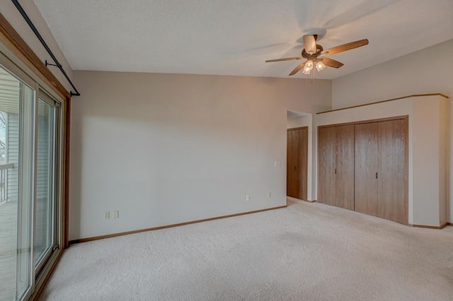 14831 Endicott Way Unit 315, Apple Valley, MN 55124 - unfurnished bedroom featuring light carpet, baseboards, two closets, and vaulted ceiling