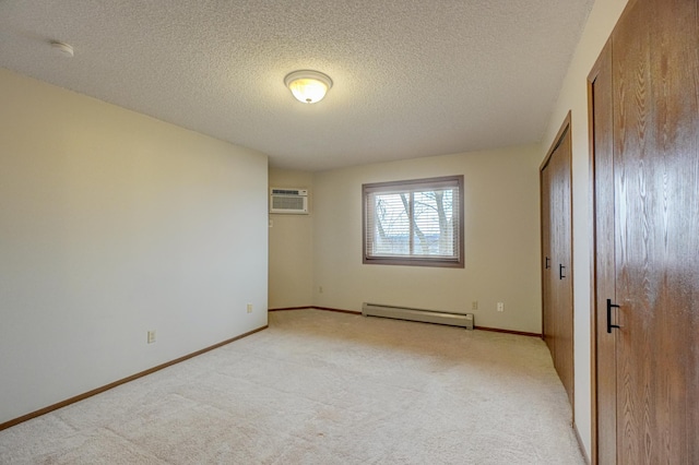14831 Endicott Way Unit 315, Apple Valley, MN 55124 - unfurnished bedroom with a textured ceiling, light colored carpet, a baseboard heating unit, a wall mounted air conditioner, and baseboards