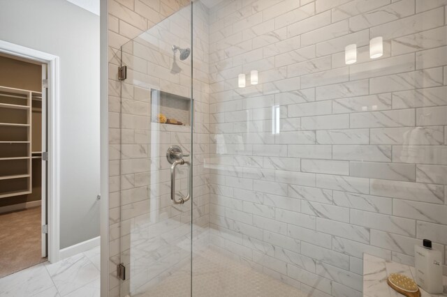 19995 Hunters Rdg, Corcoran, MN 55374 - full bath with a shower stall, marble look tile flooring, and a spacious closet